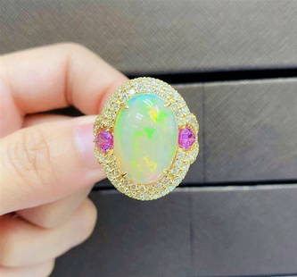 18KT LRG OPAL FANCY PINK SAPPHIRE DIAMOND RING: 18KT LRG OPAL FANCY PINK SAPPHIRE DIAMOND RING The Following Item we are offering is a Rare Important Radiant 18KT Gold Large Rare Fancy Gorgeous Opal Ring . Ring is comprised of A LARGE Magnificent