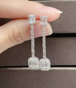 18KT GOLD GORGEOUS GLITTERING DIAMOND DANGLE EARRINGS: 18KT GOLD GORGEOUS GLITTERING DIAMOND DANGLE EARRINGS The Following Items we are offering is a Rare Important Radiant 18KT White Gold Elaborate Diamond Dangle Earrings. Earrings feature Magnificent
