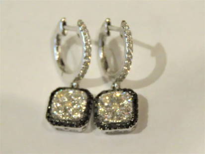 FANCY BLACK DIAMOND WHITE DIAMOND DANGLE EARRINGS: FANCY BLACK DIAMOND WHITE DIAMOND DANGLE EARRINGS The Following Items we are offering is a Pair of Rare Important Radiant Large Impressive Fancy White and Black 14KT Gold Earrings consisting of Fine