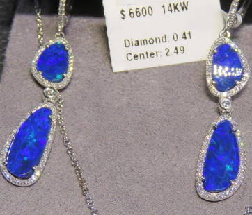 GORGEOUS AUSTRALIAN BLACK OPAL EARRINGS: GORGEOUS AUSTRALIAN BLACK OPAL EARRINGS GORGEOUS AUSTRALIAN BLACK OPAL EARRINGS The Following Items we are offering is a Rare Important Estate Radiant Pair of 14KT Gold Glistening Australian Black