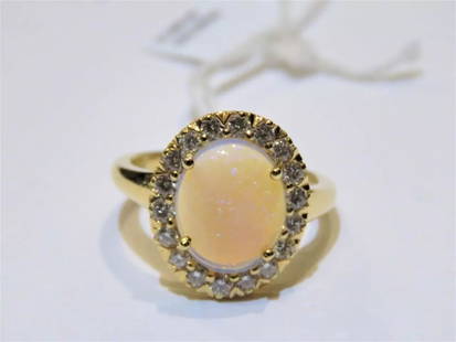18KT GORGEOUS GLITTERING ETHIOPIAN OPAL DIAMOND RING: 18KT GORGEOUS GLITTERING ETHIOPIAN OPAL DIAMOND RING The Following Item we are offering is a Rare Important Radiant 18KT Gold Large Fancy Fiery White Opal Diamond Ring. Ring is comprised of A LARGE