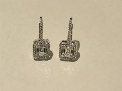 18KT BAGUETTE CLUSTER DANGLE DIAMOND EARRINGS: 18KT BAGUETTE CLUSTER DANGLE DIAMOND EARRINGS 18KT BAGUETTE CLUSTER DANGLE DIAMOND EARRINGS The Following Items we are offering is a Gorgeous Pair of Radiant 18KT White Gold Rare Large Brilliant