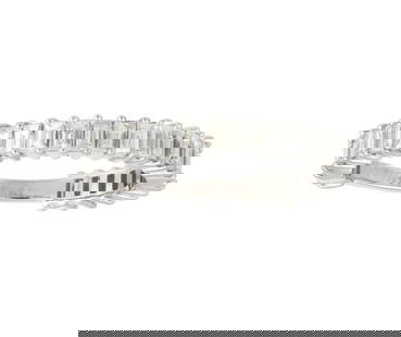 18KT GOLD BAGUETTE DIAMOND ETERNITY BAND RING: 18KT GOLD BAGUETTE DIAMOND ETERNITY BAND RING The Following Item we are offering is a Rare 18KT Gold Trillion Baguette Cut Diamond Ring Band. Ring is comprised of Finely Set Gorgeous Glittering
