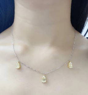 18KT GOLD RARE GORGEOUS FANCY DIAMOND PEAR DESIGN NECKLACE: 18KT GOLD RARE GORGEOUS FANCY DIAMOND PEAR DESIGN NECKLACE The Following Items we are offering is a Rare Important Radiant 18KT White and Yellow Gold Gorgeous Glittering Fancy Diamond Pendant Necklace