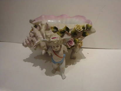 SIGNED DRESDEN PORCELAIN CONCH SHELL CENTERPIECE CHILDREN: SIGNED DRESDEN PORCELAIN CONCH SHELL CENTERPIECE CHILDREN IMPORTANT DRESDEN PORCELAIN CONCH SHELL CENTERPIECE CHILDREN Search We are are offering this Large Estate Signed Dresden Centerpiece Conch She