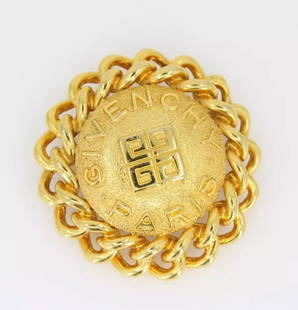 VINTAGE 1980'S GIVENCHY GOLD PLATED 2" ROUND LOGO STATEMENT PIN BROOCH SIGNED: VINTAGE 1980'S GIVENCHY GOLD PLATED 2" ROUND LOGO STATEMENT PIN BROOCH SIGNED VINTAGE 1980'S GIVENCHY GOLD PLATED 2" ROUND LOGO STATEMENT PIN BROOCH SIGNED Description Vintage 1980's Givenchy Gold