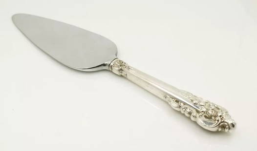 WALLACE GRANDE BAROQUE 10.5" PIE SERVER W/ STERLING SILVER HANDLE: WALLACE GRANDE BAROQUE 10.5" PIE SERVER W/ STERLING SILVER HANDLE WALLACE GRANDE BAROQUE 10.5" PIE SERVER W/ STERLING SILVER HANDLE Description Wallace Grande Baroque 10.5" Pie Server w/ Sterling Silv