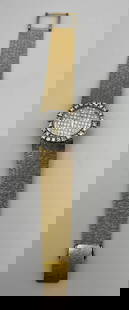 BUECHE GIROD 18K GOLD WATCH WITH DIAMOND BEZEL AND DIAMOND DIAL: BUECHE GIROD 18K GOLD WATCH WITH DIAMOND BEZEL AND DIAMOND DIAL 18K yellow gold wristwatch centered around a pave set diamond dial.&nbsp; Surrounding the dial is a bezel set with round diamonds and on