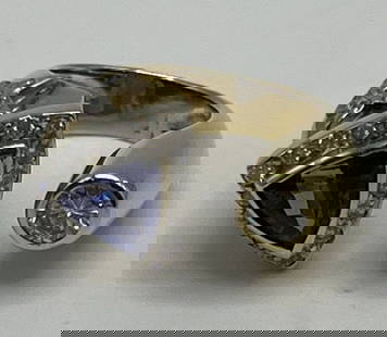14KT YELLOW GOLD, TANZANITE & DIAMOND RING WITH MOON & STAR SIZE 3.25/3.5: 14KT YELLOW GOLD, TANZANITE & DIAMOND RING WITH MOON & STAR SIZE 3.25/3.5 This stunning 14KT yellow gold ring showcases a beautiful tanzanite stone and sparkling diamond accents. The purple-hued main