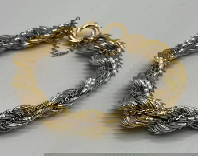 18K YELLOW GOLD TWISTED BRACELET 7" 34.9 GRAMS: 18K YELLOW GOLD TWISTED BRACELET 7" 34.9 GRAMS Crafted with elegance, this 18K yellow gold cuff bracelet is a timeless addition to any jewelry collection. The bracelet, weighing approximately 34.9