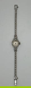 LADIES BULOVA DIAMOND WATCH: LADIES BULOVA DIAMOND WATCH 14K White Gold and Diamond Ladies Bulova WatchWatch weighs approximately 15.8 gramsHas 55 sc diamonds which weigh approximately 0.60 ctThe watch measures approximately 6.25