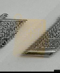 14K YELLOW GOLD BIBLE CHARM: 14K YELLOW GOLD BIBLE CHARM This beautiful Bible charm is made of 14k yellow gold, adding a touch of elegance to any necklace or pendant. The intricate design showcases exquisite craftsmanship,