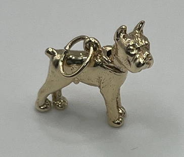 14K YELLOW GOLD BOXER DOG CHARM: 14K YELLOW GOLD BOXER DOG CHARM Show your love for your furry friend with this 14K Yellow Gold Boxer Dog Charm. Crafted from high-quality yellow gold, this charming pendant is the perfect accessory