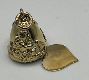 VINTAGE 18K YELLOW GOLD DETAILED BUDDHA BELL W/ DANGLE HEART CHARM PENDANT: VINTAGE 18K YELLOW GOLD DETAILED BUDDHA BELL W/ DANGLE HEART CHARM PENDANT This vintage 18K yellow gold pendant is a unique piece of fine jewelry. The intricate design features a bell shape with a