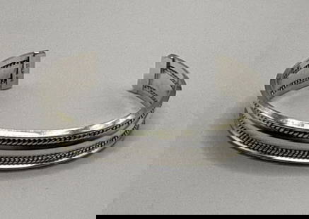 NAVAJO BRACELET .925 SILVER HANDMADE HAND STAMPED SIGNED ARTIST TAHE CIRCA 1980S: NAVAJO BRACELET .925 SILVER HANDMADE HAND STAMPED SIGNED ARTIST TAHE CIRCA 1980S This exquisite Navajo cuff bracelet is a stunning example of handmade artistry by renowned artist TAHE. Crafted from hi