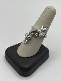 STERLING SILVER SIZE 9.25 DRAGON RING WITH RUBY EYES: STERLING SILVER SIZE 9.25 DRAGON RING WITH RUBY EYES This exquisite dragon ring is a must-have for anyone who loves fine jewelry. Made of sterling silver with a total weight of approximately 5.8 grams