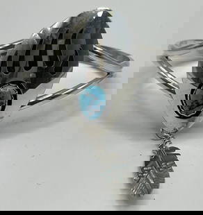 STERLING SILVER & TURQUOISE BEAR CLAW CUFF BRACELET LESTER OTRIZ: STERLING SILVER & TURQUOISE BEAR CLAW CUFF BRACELET LESTER OTRIZ This Native American inspired cuff bracelet features a beautiful turquoise bear claw design, crafted from high-quality sterling silver.