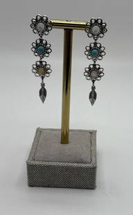 CAROLYN POLLACK-STERLING SW TURQUOISE MOONSTONE FLOWER DANGLE POST EARRINGS: CAROLYN POLLACK-STERLING SW TURQUOISE MOONSTONE FLOWER DANGLE POST EARRINGS The product is a pair of Carolyn Pollack sterling silver earrings featuring a flower design with turquoise and moonstone sto