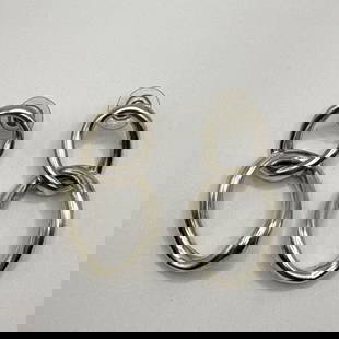 STERLING SILVER DOUBLE TWIST LOOP DANGLING EARRINGS: STERLING SILVER DOUBLE TWIST LOOP DANGLING EARRINGS Crafted with a contemporary design, these Sterling Silver Double Twist Loop Dangling Earrings offer a modern twist to your everyday fashion. The ear