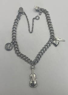 7" DOUBLE LINK STERLING SILVER CHARM BRACELET WITH 3 CHARMS 11.2 GRAMS: 7" DOUBLE LINK STERLING SILVER CHARM BRACELET WITH 3 CHARMS 11.2 GRAMS The 7" Double Link Sterling Silver Charm Bracelet with 3 Charms weighs 11.2 grams and features a Silver Charm brand. Crafted from