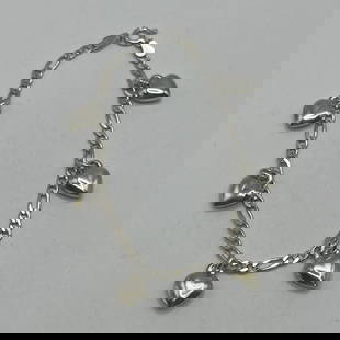 7" STERLING SILVER FIGARO LINK BRACELET WITH 6 PUFFY HEARTS 8.6 GRAMS: 7" STERLING SILVER FIGARO LINK BRACELET WITH 6 PUFFY HEARTS 8.6 GRAMS This 7" Sterling Silver Figaro Link Bracelet features six puffy hearts as charms, adding a touch of elegance and sweetness to the