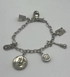 7.5" STERLING SILVER CHARM BRACELET WITH 6 CHARMS: 7.5" STERLING SILVER CHARM BRACELET WITH 6 CHARMS 16.1 grams This 7.5" Sterling Silver Charm Bracelet features six charms, making it a stylish and versatile piece of fine jewelry. Crafted from 925 ste