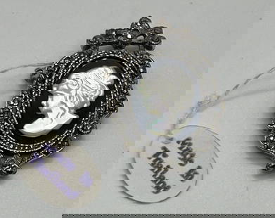 VINTAGE STERLING SILVER & MARCASITE CAMEO PENDANT/BROOCH: VINTAGE STERLING SILVER & MARCASITE CAMEO PENDANT/BROOCH This vintage piece of jewelry is a stunning example of the beauty that can be achieved with sterling silver and marcasite. The intricate cameo