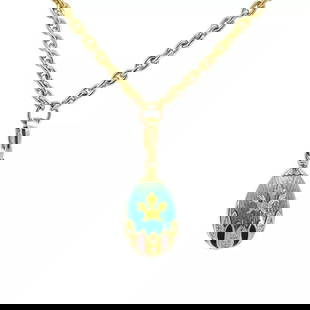 FABERGE DIAMOND EGG PENDANT NECKLACE 18K YELLOW GOLD GUILLOCHE ENAMEL: FABERGE DIAMOND EGG PENDANT NECKLACE 18K YELLOW GOLD GUILLOCHE ENAMEL This is an authentic Faberge egg pendant and chain necklace. It is crafted from 18k yellow gold with a polished finish. The pendan