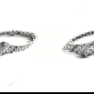 PLATINUM ART DECO BRACELET 3.5CT DIAMOND FLORAL CENTERPIECE CUBE LINKS: The platinum Art Deco bracelet is a stunning piece of antique jewelry featuring a floral centerpiece with a sparkling diamonds accented with blue colored stones, the milgrain filigree asymmetrical sha
