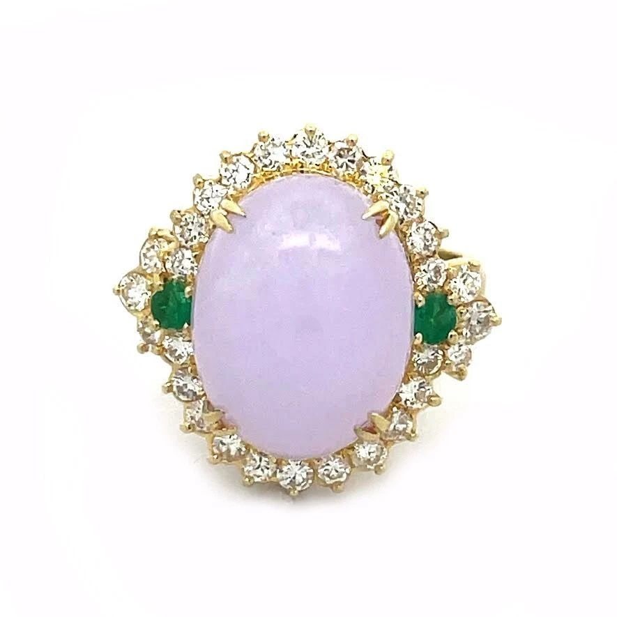 DIAMOND LAVENDER JADE RING EMERALD 18K YELLOW GOLD COCKTAIL: DIAMOND LAVENDER JADE RING EMERALD 18K YELLOW GOLD COCKTAIL This lovely cocktail ring is crafted from 18k yellow gold featuring an oval shape bridge with a large oval cabochon lavender jade in the cen