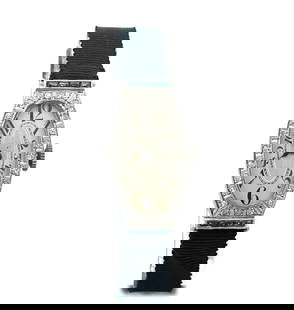 ART DECO DIAMOND PLATINUM HAND WIND ELONGATED LADIES WRISTWATCH: ART DECO DIAMOND PLATINUM HAND WIND ELONGATED LADIES WRISTWATCH This is a beautiful Art Deco platinum hand wind ladies watch, the frame is elongated with with an oval shape face and diamonds around