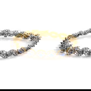 DIAMOND GOLD BRACELET 14K OVAL FLOWER LINK: DIAMOND GOLD BRACELET 14K OVAL FLOWER LINK This Diamond Gold Bracelet features a beautiful oval-shaped diamond set in 14k multi-tone gold. The bracelet is 7 inches in length and has a tennis style des