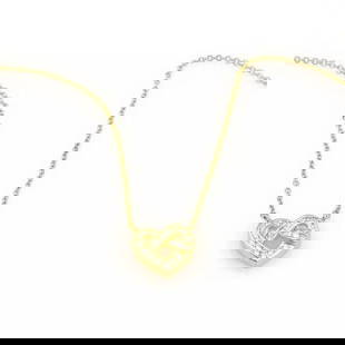 TIFFANY & CO. HEART PENDANT 18K YELLOW GOLD DIAMOND KNOT NECKLACE: TIFFANY & CO. HEART PENDANT 18K YELLOW GOLD DIAMOND KNOT NECKLACE Tiffany & Co. 18K Yellow Gold Diamond Heart Knot Pendant & Chain Description This is an authentic pendant and chain necklace from Tiff
