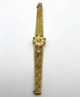 WOMAN'S VINTAGE LA MARTINE 18K GOLD WATCH SET WITH 0.50CTS OF RUBIES: WOMAN'S VINTAGE LA MARTINE 18K GOLD WATCH SET WITH 0.50CTS OF RUBIES Woman's Vintage La Martine 18k Gold Watch set with 0.50cts of Rubies Condition: Vintage used, runs and keeps time Material: 18k Yel