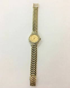 WOMAN'S 14K YELLOW GOLD GENEVE QUARTZ DIAMOND WATCH: WOMAN'S 14K YELLOW GOLD GENEVE QUARTZ DIAMOND WATCH Woman's 14k Yellow Gold Geneve Quartz Diamond Watch You are bidding on a pre-owned Woman's 14k Yellow Gold Geneve Quartz Diamond Watch. Watch has sc