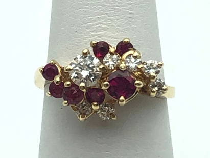 14K GOLD RING WITH 0.71CTS NATURAL RUBIES AND 0.50CTS OF DIAMONDS   SIZE: 5.75: 14K GOLD RING WITH 0.71CTS NATURAL RUBIES AND 0.50CTS OF DIAMONDS SIZE: 5.75 14k Gold Ring cluster with Rubies and 0.50cts of Diamonds Condition: Used Material: 14k Yellow Gold Ring Size: 5.75 Weight: