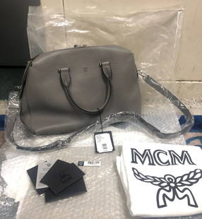 MCM TRADESY LARGE ELLA BOSTON BUNGEE CORD LEATHER SATCHE: MCM TRADESY LARGE ELLA BOSTON BUNGEE CORD LEATHER SATCHE MCM Tradesy Large Ella Boston Bungee Cord Leather Satche You are bidding on a MCM Tradesy Large Ella Boston Bungee Cord Leather Satche. The bag