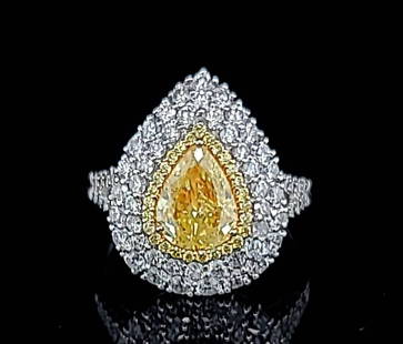 18K WHITE GOLD ENGAGEMENT RING 2.42CT. NATURAL FANCY YELLOW DIAMOND PEAR SHAPE: 18K WHITE GOLD ENGAGEMENT RING 2.42CT. NATURAL FANCY YELLOW DIAMOND PEAR SHAPE This stunning 18k white gold engagement ring features a 1.05ct pear-shaped natural fancy yellow diamond, surrounded by sp
