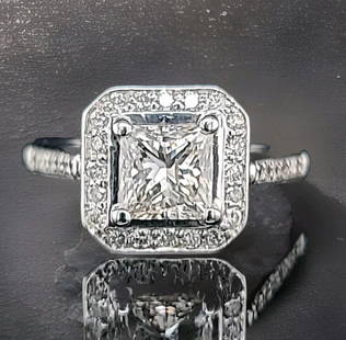VINTAGE 14K WHITE GOLD ENGAGEMENT RING 1.42CT. NATURAL PRINCESS CUT DIAMOND: VINTAGE 14K WHITE GOLD ENGAGEMENT RING 1.42CT. NATURAL PRINCESS CUT DIAMOND This stunning vintage engagement ring features a 1.42 carat natural princess cut diamond in a solitaire setting with accents