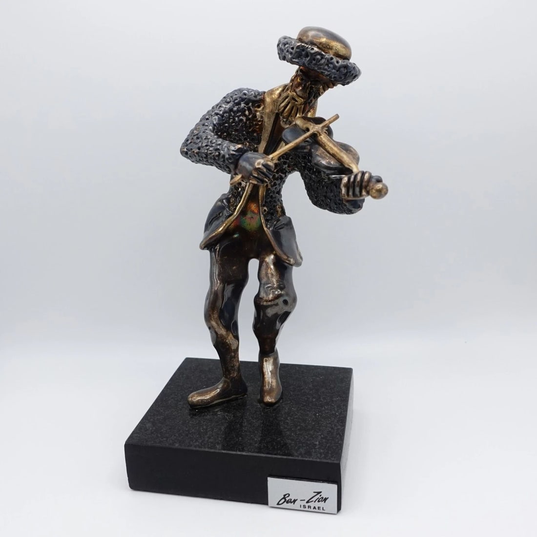 BEN ZION ISRAEL STERLING SILVER MAN PLAYING FIDDLER FIGURINE BLAMARBLE BASE - 7": BEN ZION ISRAEL STERLING SILVER MAN PLAYING FIDDLER FIGURINE BLAMARBLE BASE - 7" Ben Zion Israel Sterling Silver Man Playing Fiddler Figurine w. Marble Base Height - 7" Base Length - 3" Base Width - 2