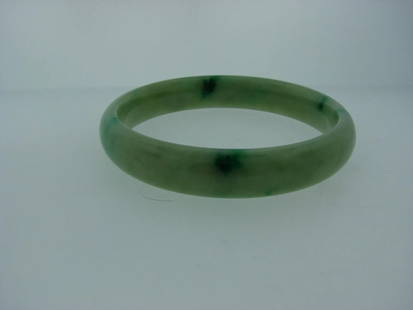 JADE BANGLE VINTAGE BRACELET: JADE BANGLE VINTAGE BRACELET JADE BANGLE LENGTH almost up to 7 1/2'' INNER DIAMETER 2 3/8'' WIDTH 7/16'' Weight: 44.3 grams Condition: GOOD