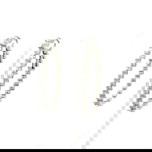 1.07 CARAT ROUND BRILLIANT G VS1 DIAMOND 14 KARAT WHITE GOLD HOOP EARRINGS: 1.07 CARAT ROUND BRILLIANT G VS1 DIAMOND 14 KARAT WHITE GOLD HOOP EARRINGS PRODUCT DESCRIPTION Title: 1.07 Carat Round Brilliant G VS1 Diamond 14 Karat White Gold Hoop Earrings Style: Hoop Metal: 14 K