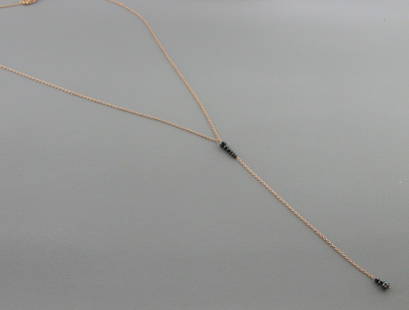 14K ROSE GOLD BLACK DIAMOND LARIAT DANGLE DROP NECKLACE: 14K ROSE GOLD DIAMOND LARIAT NECKLACENecklace measures 16" Long Drop measures 3.6" long14K rose gold9 Black Diamonds, Total weight 0.65ctNewStamped 585Total weight 1.3 grams