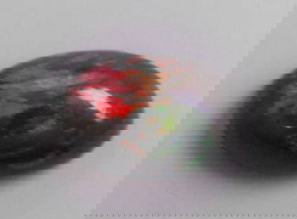 3.60ct AFRICAN BLACK OPAL OVAL CABOCHON CUT NATURAL: LOOSE NATURAL UNTREATED OVAL CABOCHON BLACK OPALOpal measures apx 14.3x8.8x5.6mmNatural untreated African Black Opal3.60ctAll pictures are taken without any artificial light, only natural daylight, so