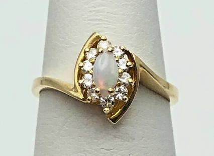 14K GOLD RING WITH NATURAL OPAL AND 0.13CTS OF DIAMONDS   SIZE: 6.5: 14K GOLD RING WITH NATURAL OPAL AND 0.13CTS OF DIAMONDS SIZE: 6.5 14k Gold Ring with Opal and 0.13cts of Diamonds Condition: Used Material: 14k Yellow Gold Ring Size: 6.5 Weight: 2.8 grams Top Width: