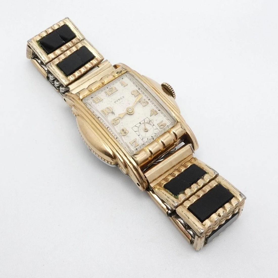 PYREX 10K ROLLED YELLOW GOLD PLATED MANUAL WATCH - 27MM X 36MM PARTS REPAIR: Vintage Pyrex 10K Rolled Yellow Gold Plated Art Deco Style with 1/20 10K Gold Filled Tops Speidel Expandable Bracelet Manual Watch Made in Switzerland Fits up to 6.25" Wrist Case Size - 27mm x 36mm To