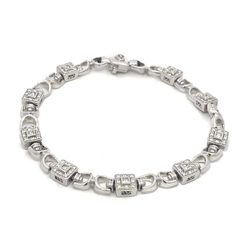 CHARRIOL DIAMOND BRACELET 18K WHITE GOLD SQUARE LINK DESIGN: CHARRIOL DIAMOND BRACELET 18K WHITE GOLD SQUARE LINK DESIGN CHARRIOL DIAMOND BRACELET 18K WHITE GOLD SQUARE LINK DESIGN This elegant authentic bracelet is by Charriol, it is crafted from 18k white gol