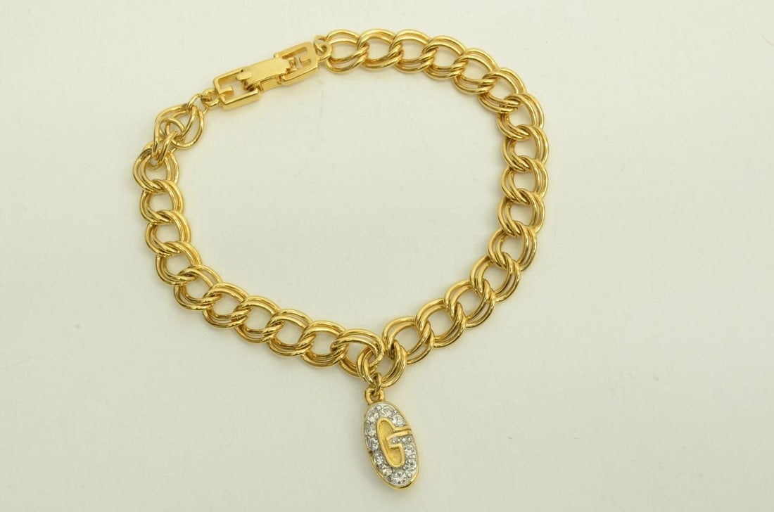 AUTHENTIC GIVENCHY GP LOGO CHARM BRACELET RHINESTONE OVAL GOLD EMBLEM JEWELRY: Authentic Givenchy GP Logo Charm Bracelet Rhinestone Oval Gold Emblem Jewelry AUTHENTIC GIVENCHY GP LOGO CHARM BRACELET RHINESTONE OVAL GOLD EMBLEM JEWELRY Givenchy Vintage Chain Charm Pendant Bracele