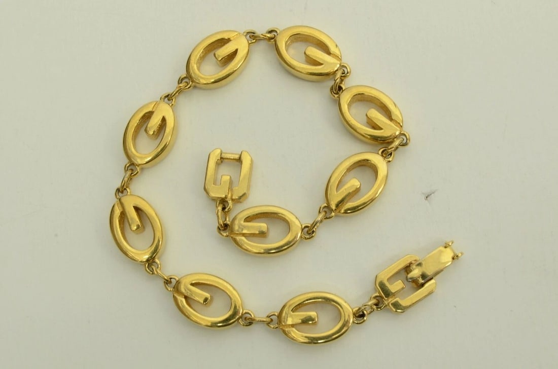 AUTHENTIC GIVENCHY GP LOGO CHARM BRACELET LINKING OVAL GOLD EMBLEM JEWELRY: Authentic Givenchy GP Logo Charm Bracelet Linking Oval Gold Emblem Jewelry AUTHENTIC GIVENCHY GP LOGO CHARM BRACELET LINKING OVAL GOLD EMBLEM JEWELRY Givenchy Vintage Logo Emblem Charm Link Bracelet J
