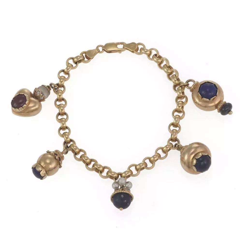 14K YELLOW GOLD LAPIS PEARLS RUBY CHARMS CHAIN BRACELET: 14K YELLOW GOLD LAPIS PEARLS RUBY CHARMS CHAIN BRACELET 14k Yellow Gold Lapis Pearls Ruby Charms Chain Bracelet Description This lovely bracelet is crafted from 14k yellow gold featuring 5 dangling ch